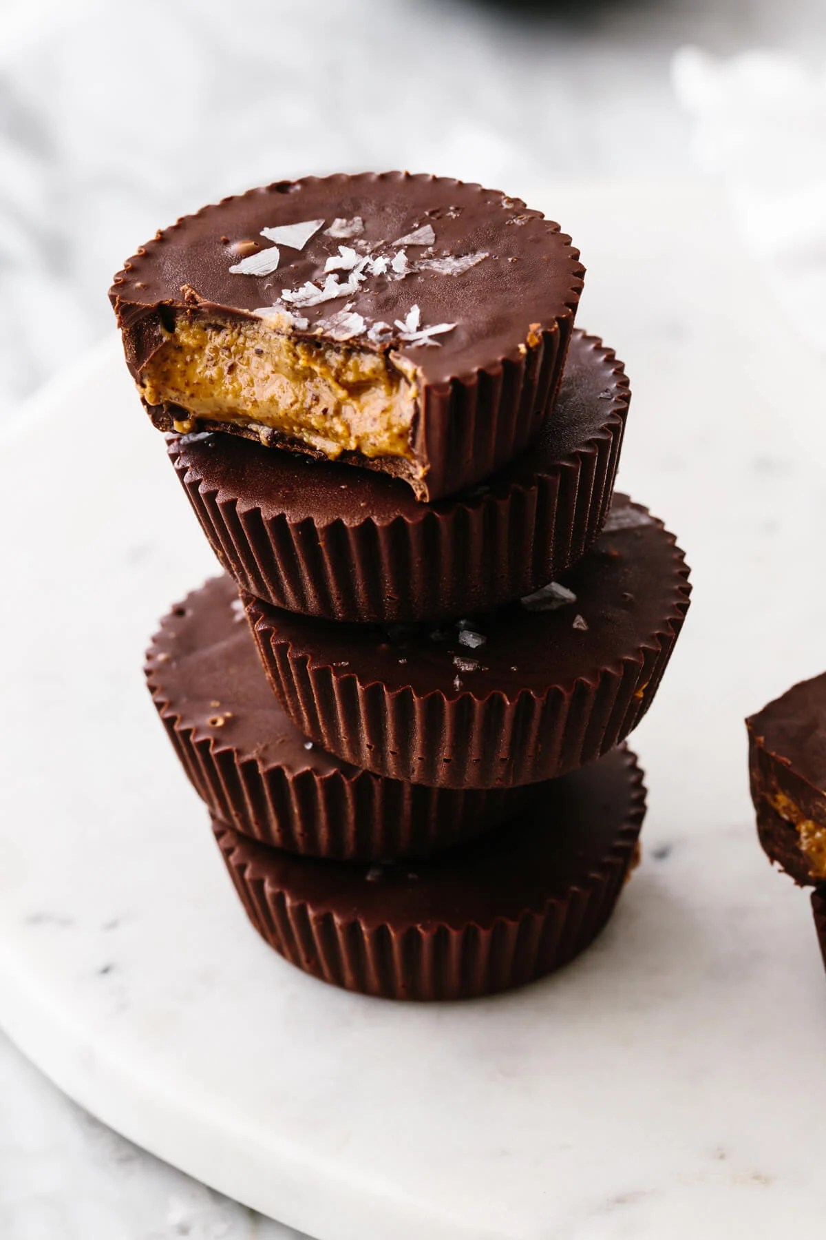 Almond butter cups layered on top of each other.