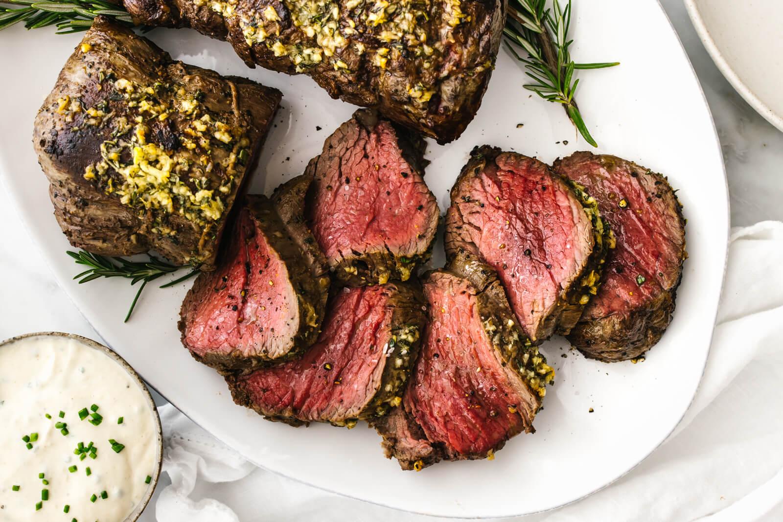 A plate of sliced beef tenderloin roast