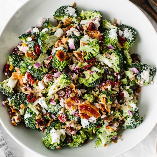 A large serving bowl of broccoli salad