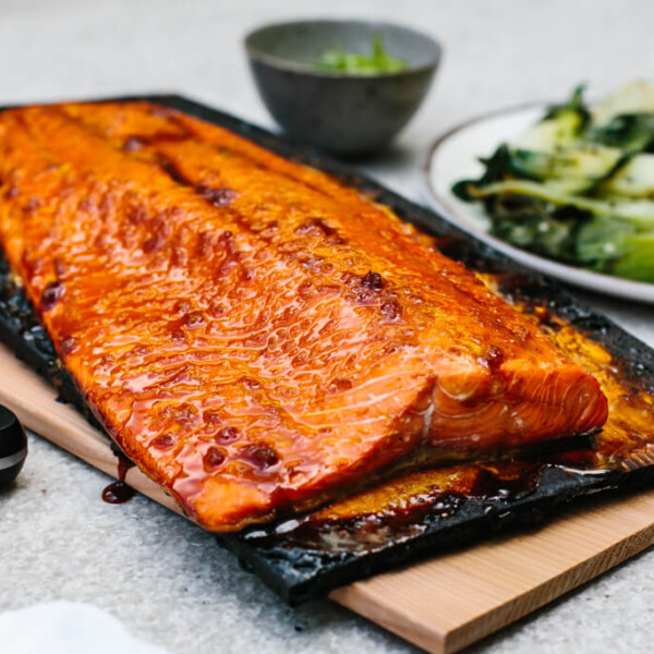 Cedar plank salmon on charred grilling planks.