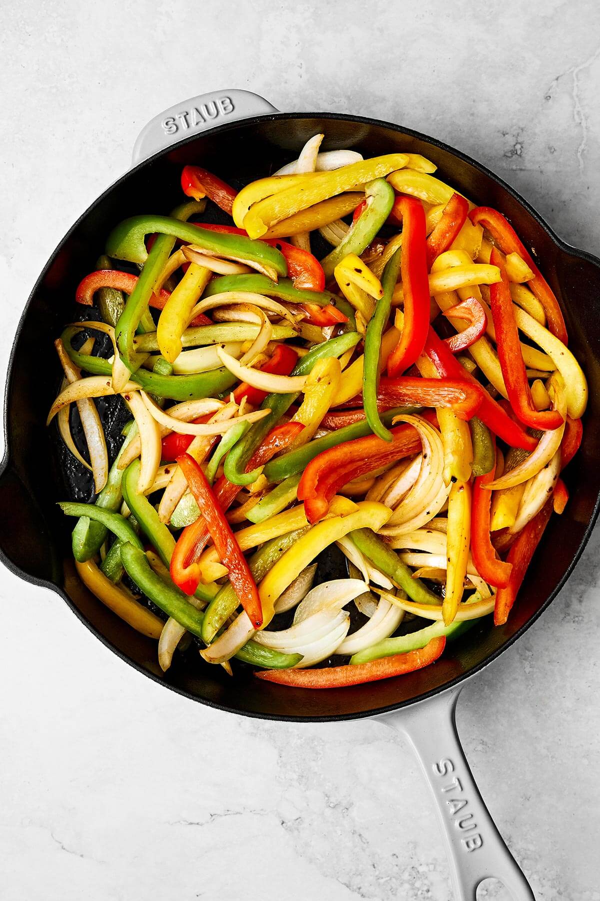 Cooking vegetables in a skillet.