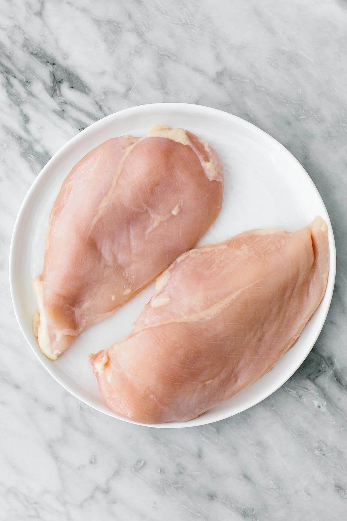 Chicken breasts on a plate.