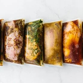 Chicken marinades packed in a row.