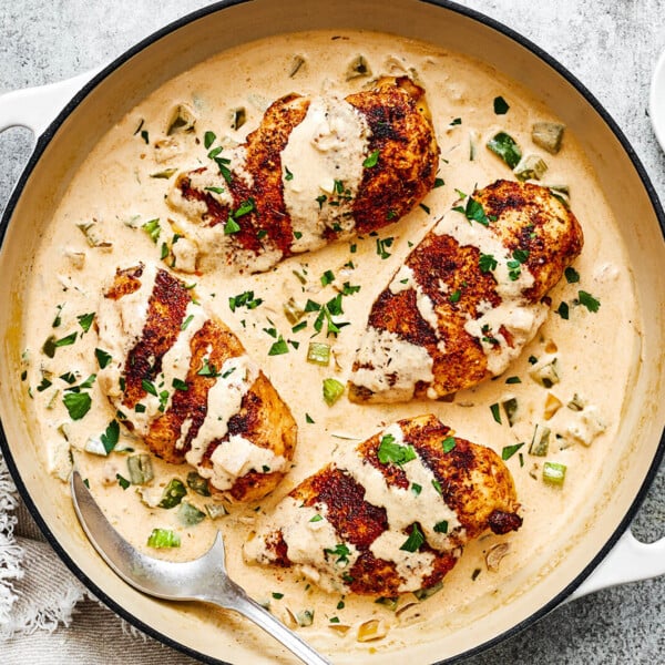 A white pan of creamy cajun chicken