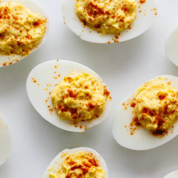 Deviled eggs are hard boiled eggs where the yolk is mixed with mayonnaise, mustard, vinegar, salt and pepper. A little sprinkle of paprika on top helps make these the best deviled eggs recipe.