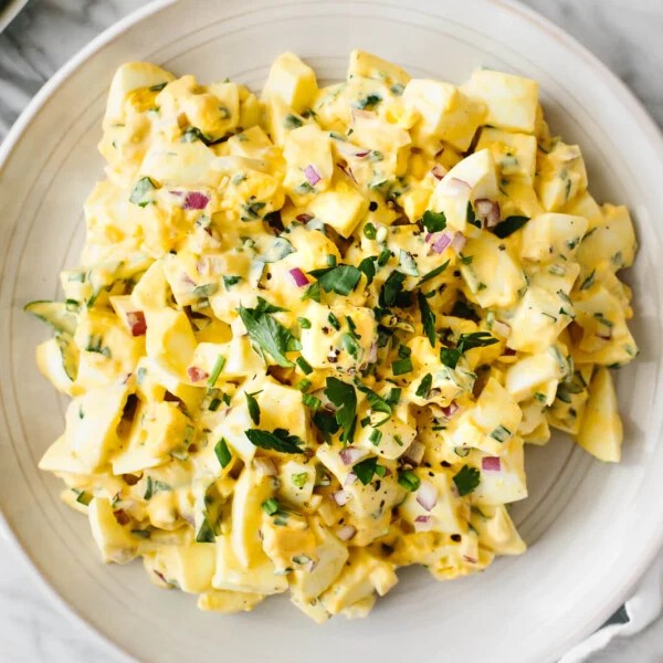 Egg salad on a white plate.