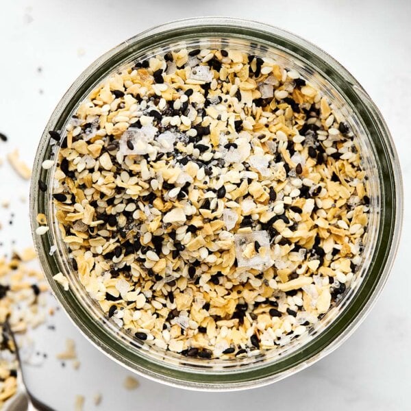 A glass jar of everything bagel seasoning.