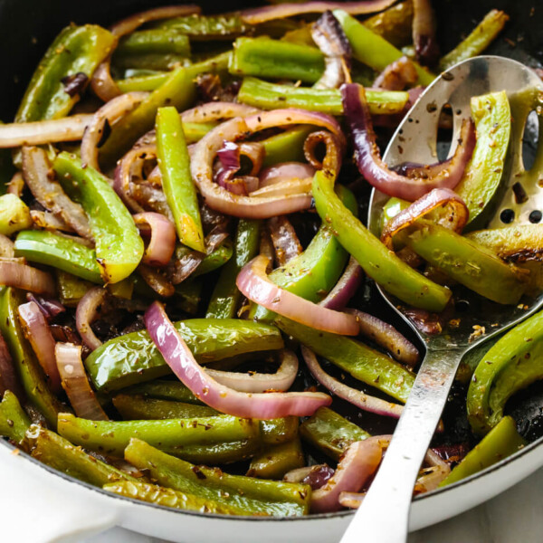 Sauteeing fajita veggies in a skillet.