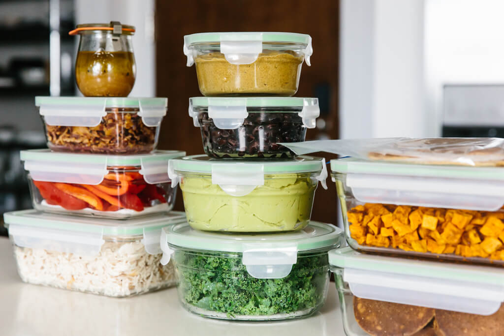 Individual ingredients meal prepped and stacked in containers.