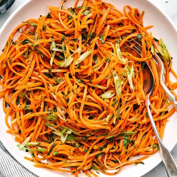 A white plate of French carrot salad.