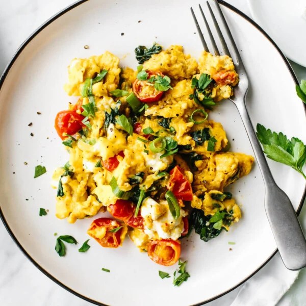 A white plate of Greek scrambled eggs