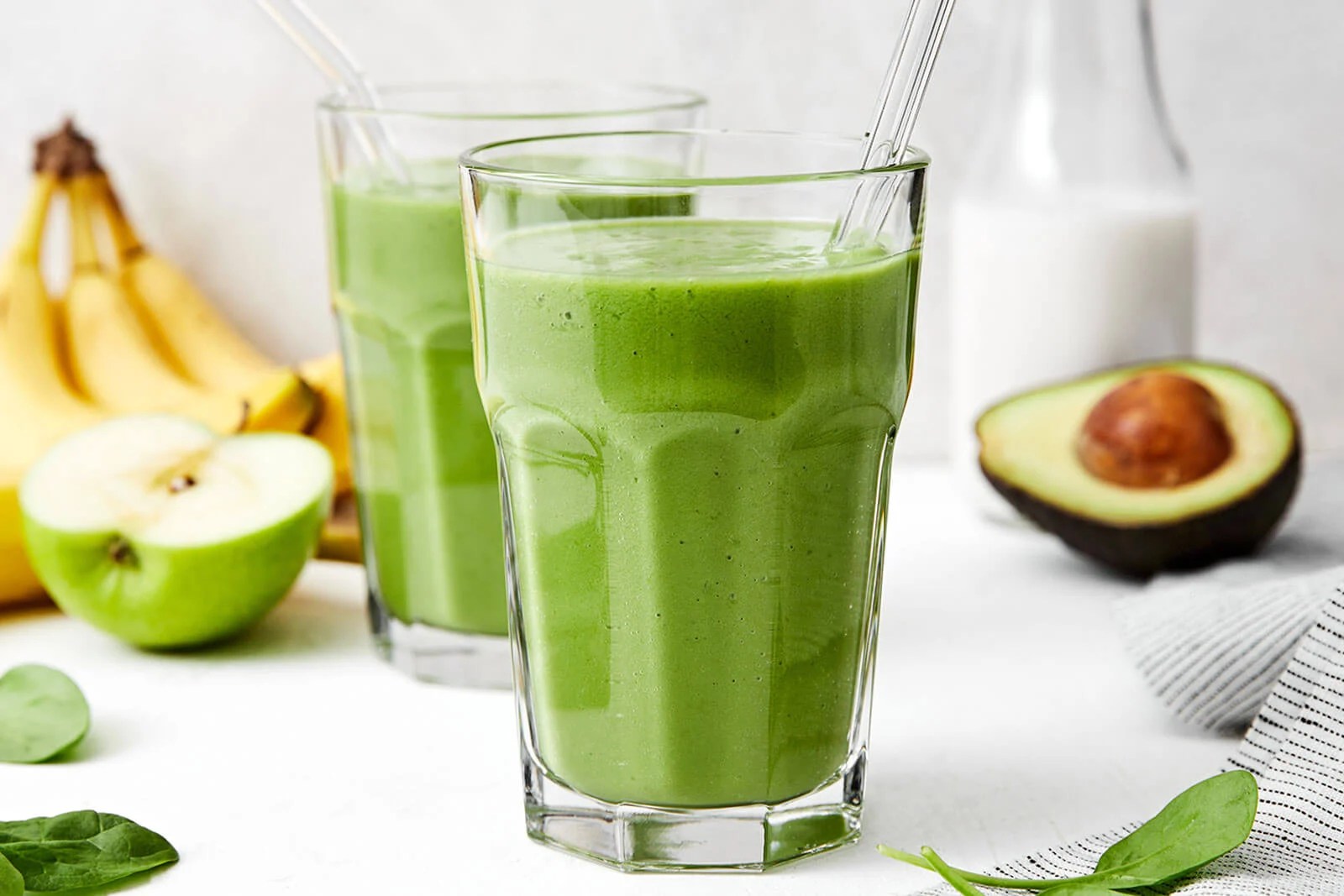 A glass of a green smoothie.