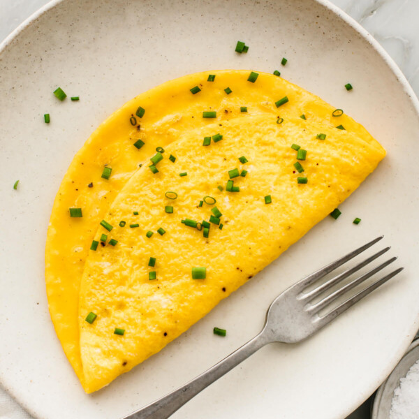 A plate with an omelette and a fork