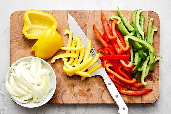 Sliced vegetables on a wooden board.