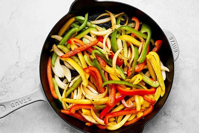 A skillet of fajita veggies.