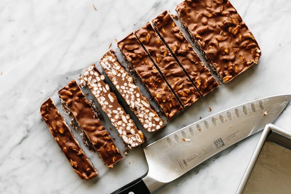 Sliced chocolate crunch bars on a table.