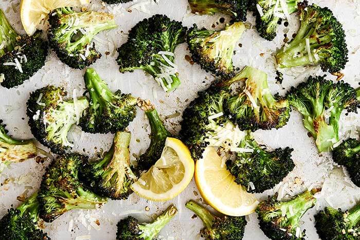 A sheet pan of roasted broccoli with parmesan.