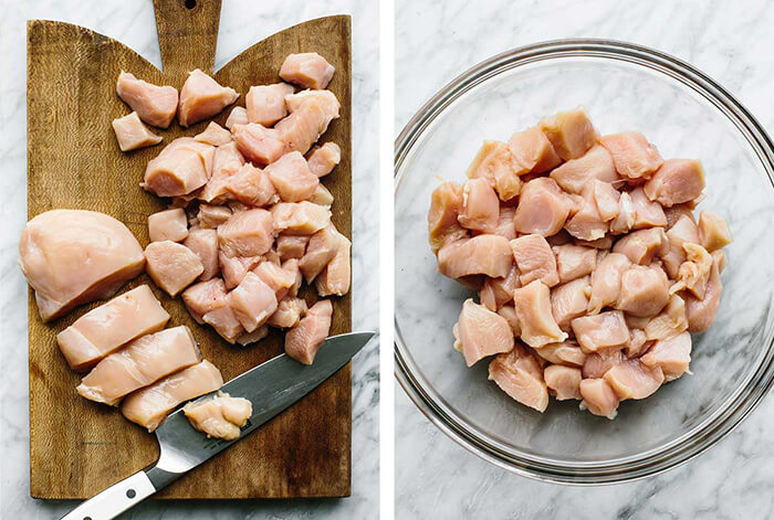 Slicing chicken on a wooden board