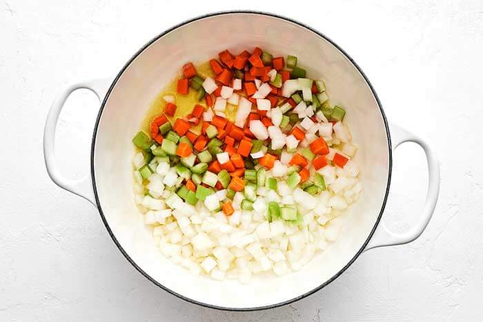 Mirepoix vegetables in a pot.