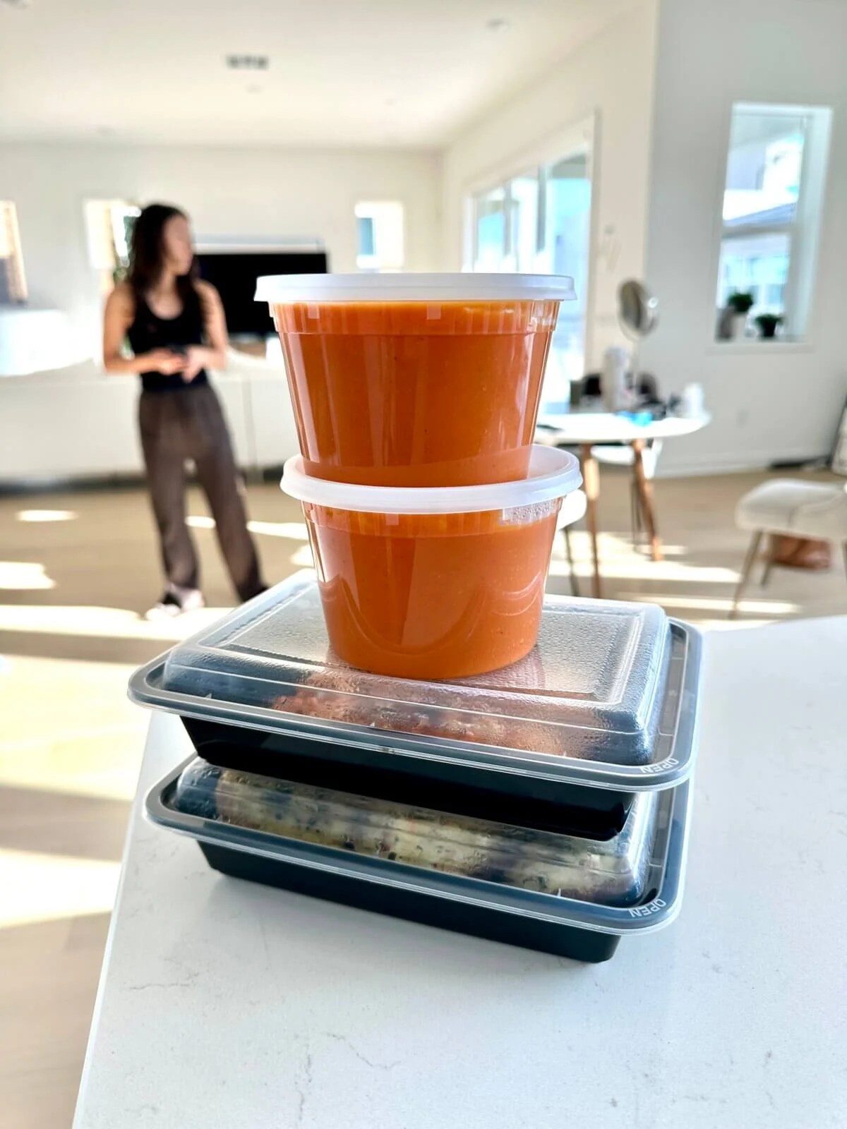 Leftovers of tomato soup recipe in containers.