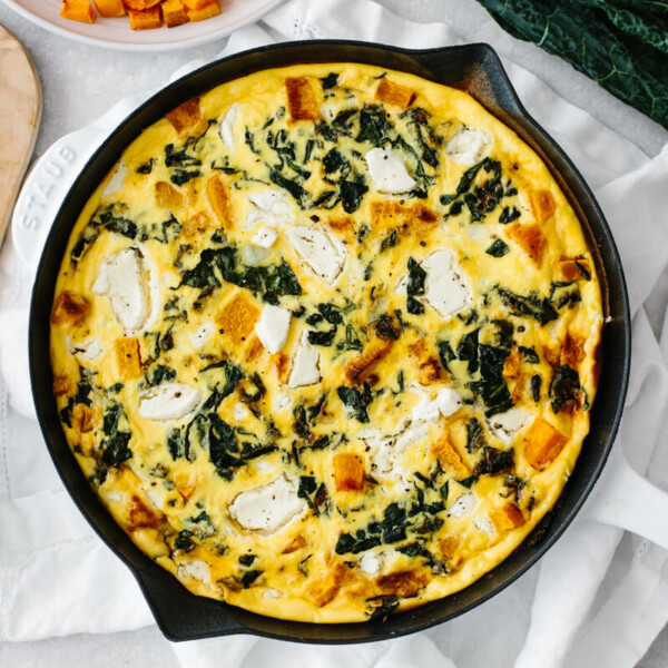 Kale and butternut squash frittata served on a table.