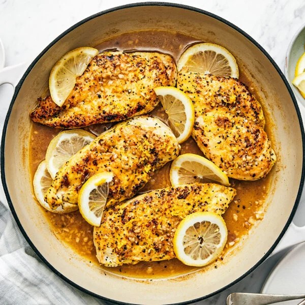 A pan with lemon pepper chicken.