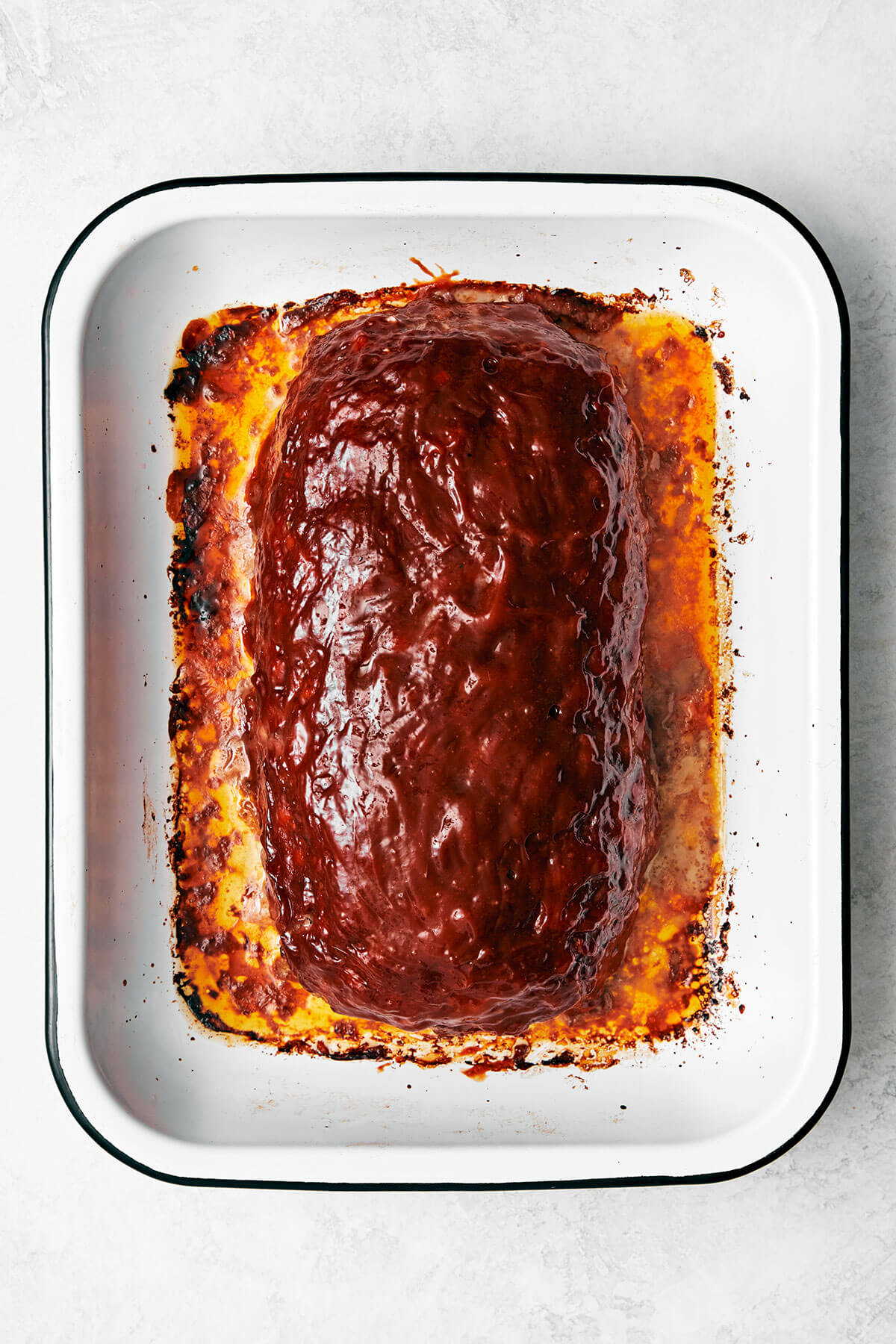 Cooked meatloaf in a pan.