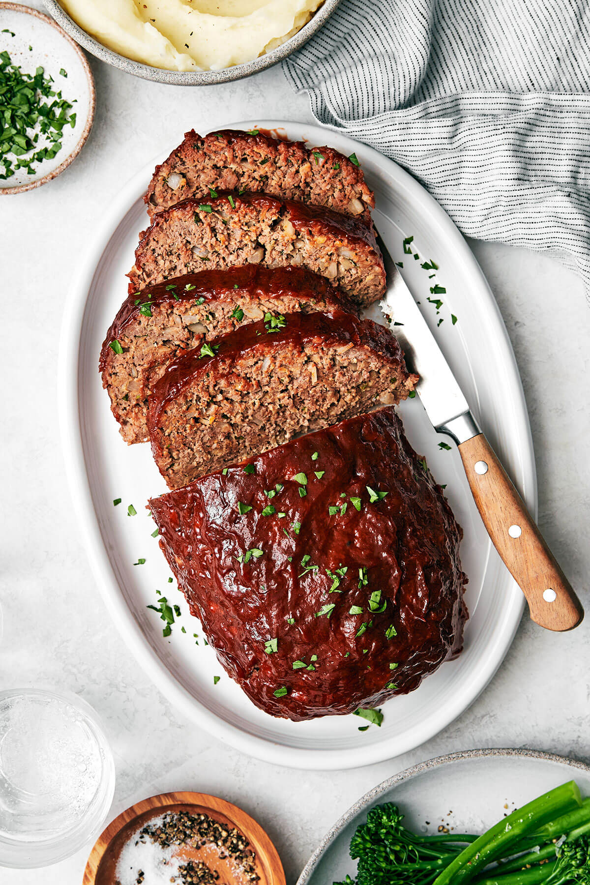 A white plate of meatloaf.