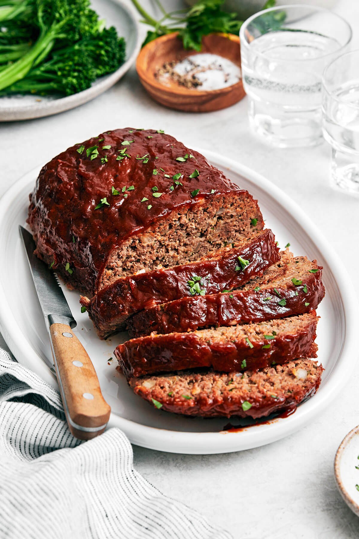 Sliced meatloaf on a platter.