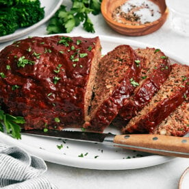 A platter of sliced meatloaf.