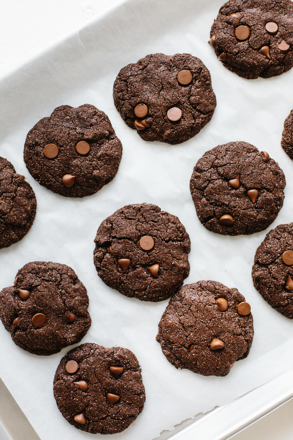 These gluten-free, paleo-friendly mint double chocolate cookies are rich, decadent and highly addictive. They're firm on the outside and lusciously soft on the inside.