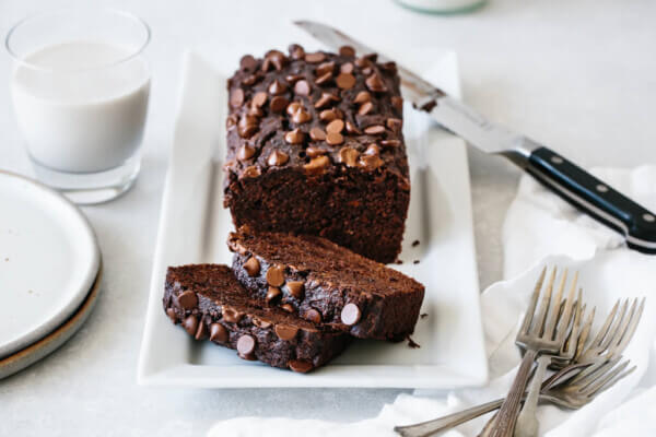 paleo chocolate zucchini bread on a white serving platter.