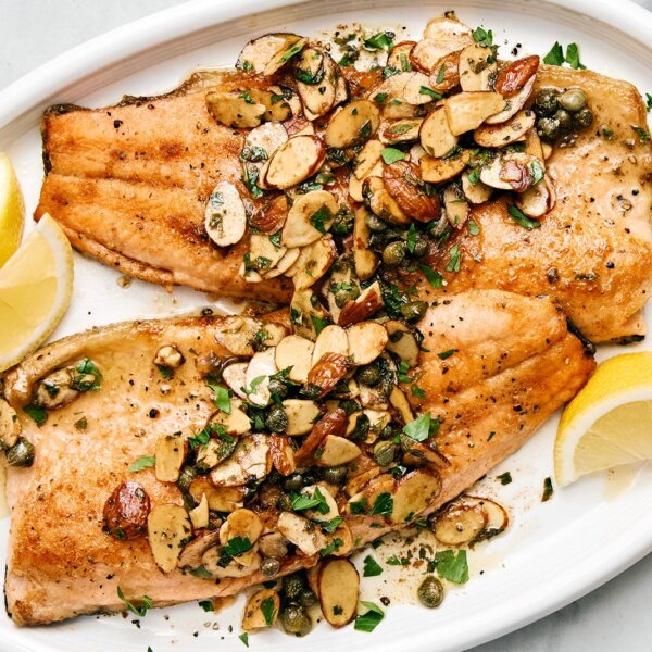 Rainbow trout almondine on a plate.