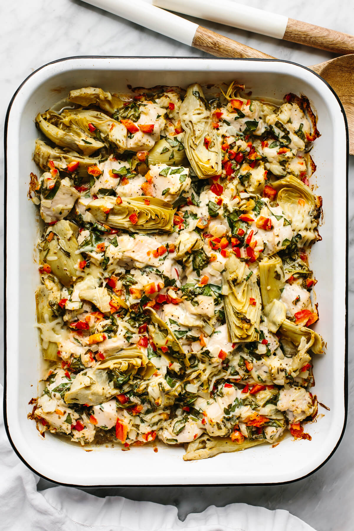 Spinach artichoke chicken bake in a casserole pan