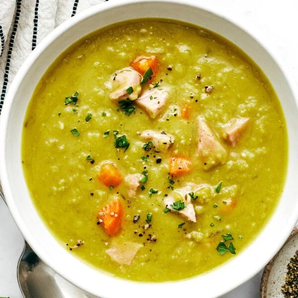 Split pea soup in a white bowl.