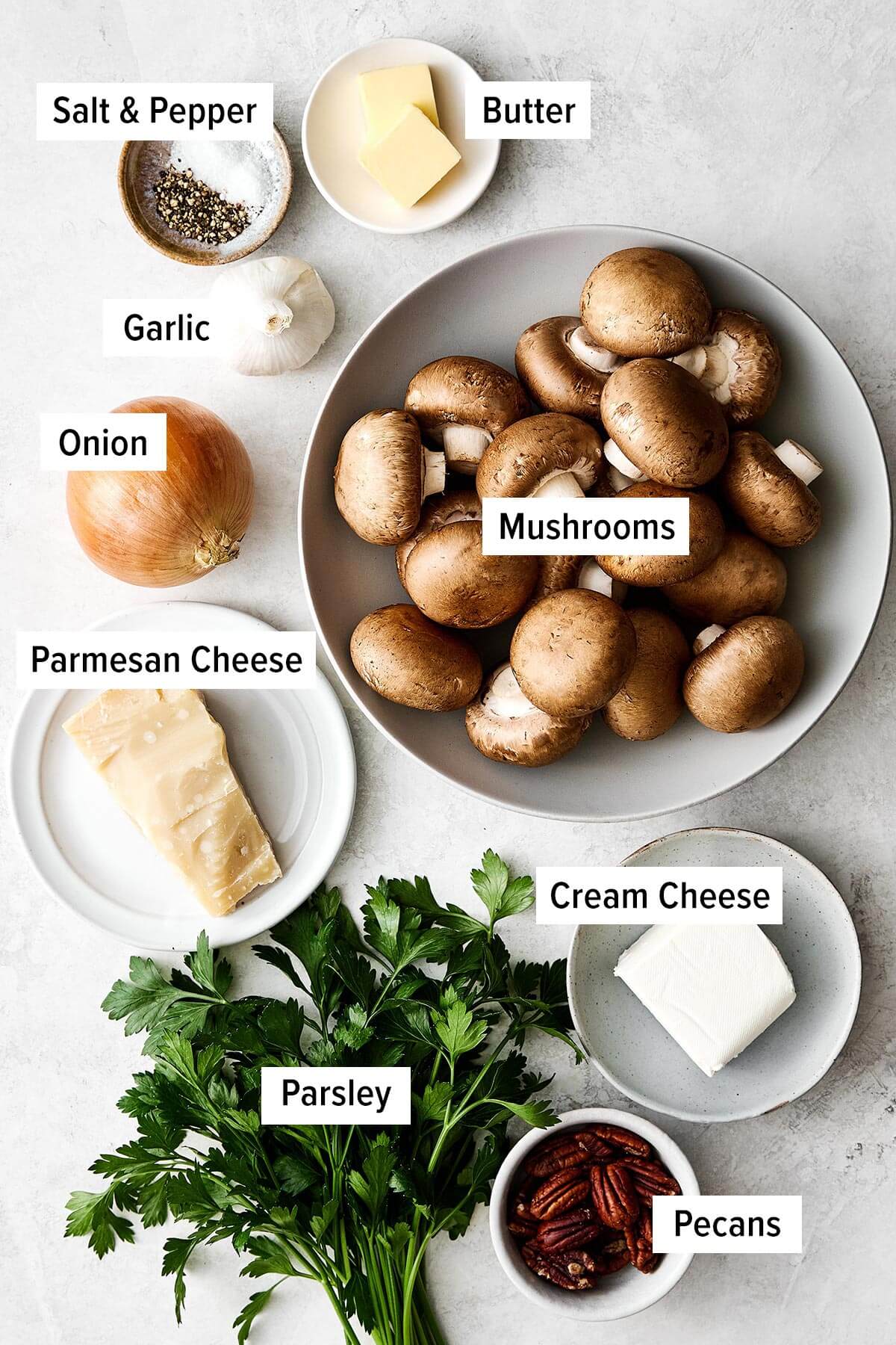 Ingredients for stuffed mushrooms on a table.