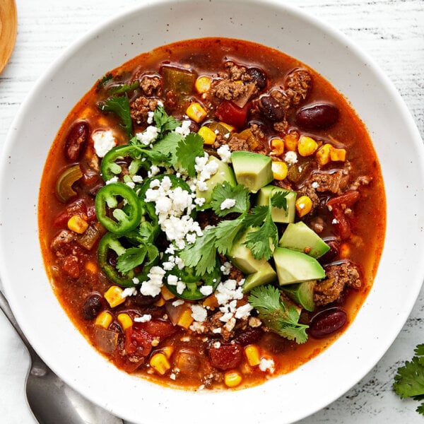 A bowl of taco soup with avocado