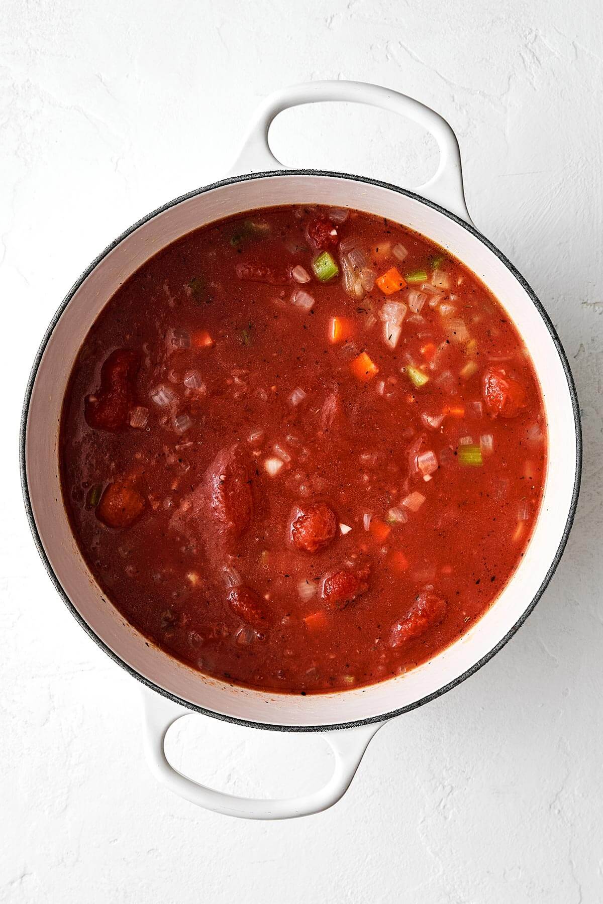 Cooking tomato soup in a pot.