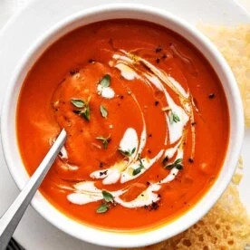 A bowl of creamy tomato soup.