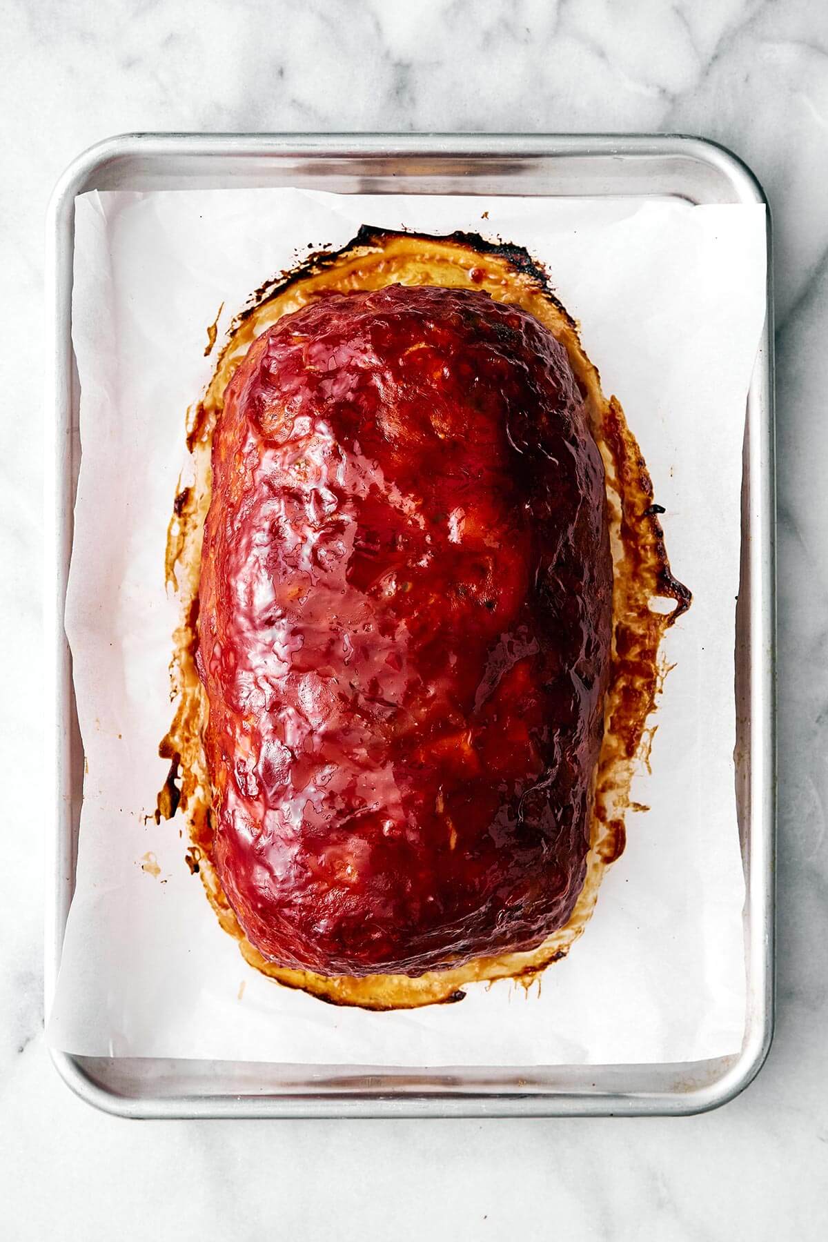 Cooked turkey meatloaf on a baking pan.