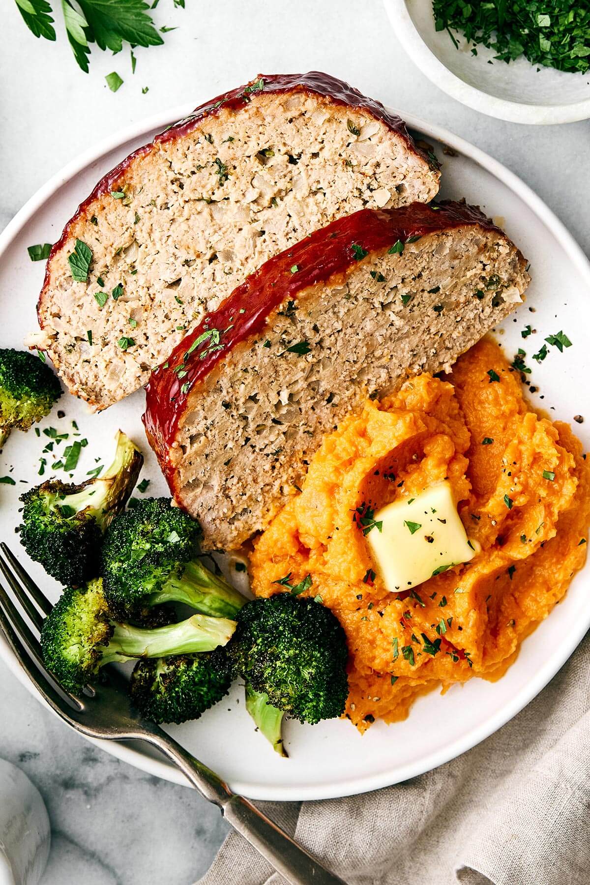 Turkey meatloaf slices with mashed sweet potato.