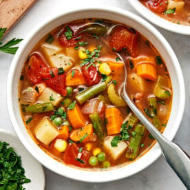 A white bowl of vegetable soup