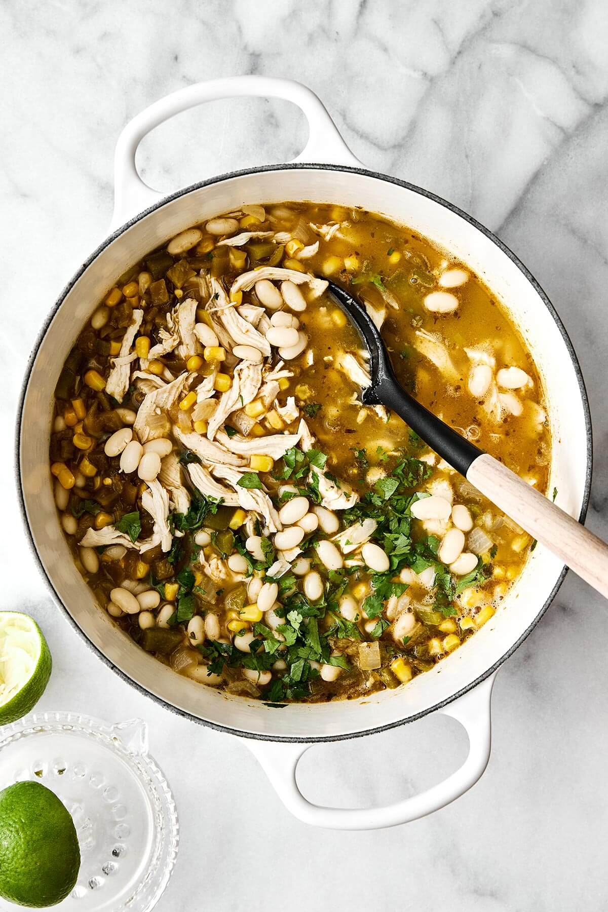 Simmering white chicken chili in a pot.