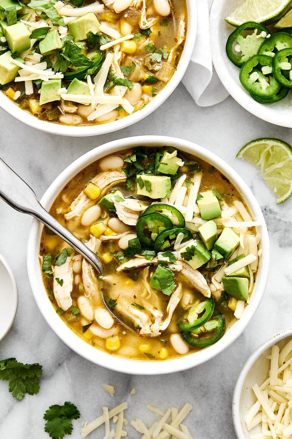 Bowls of white chicken chili.