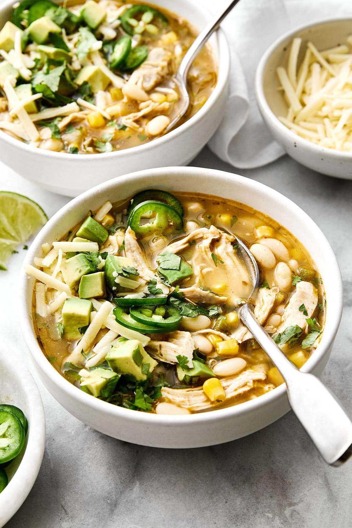 Bowl of white chicken chili and a spoon.