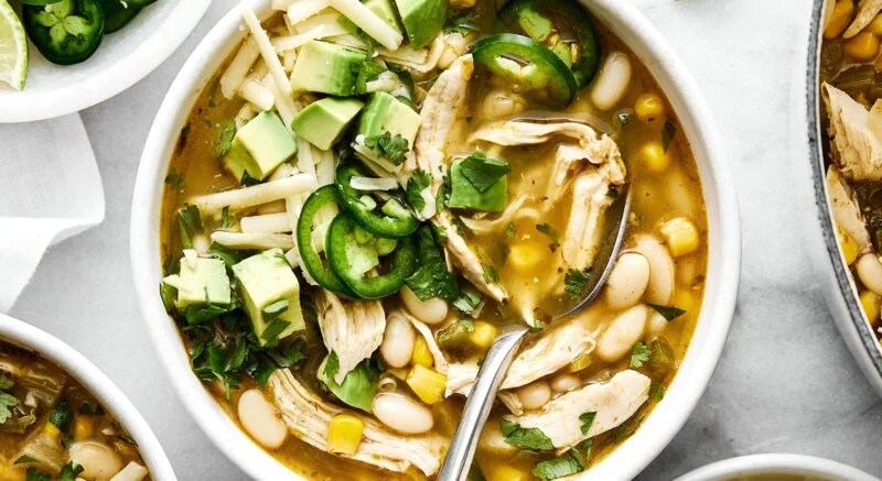 A white bowl of white chicken chili.